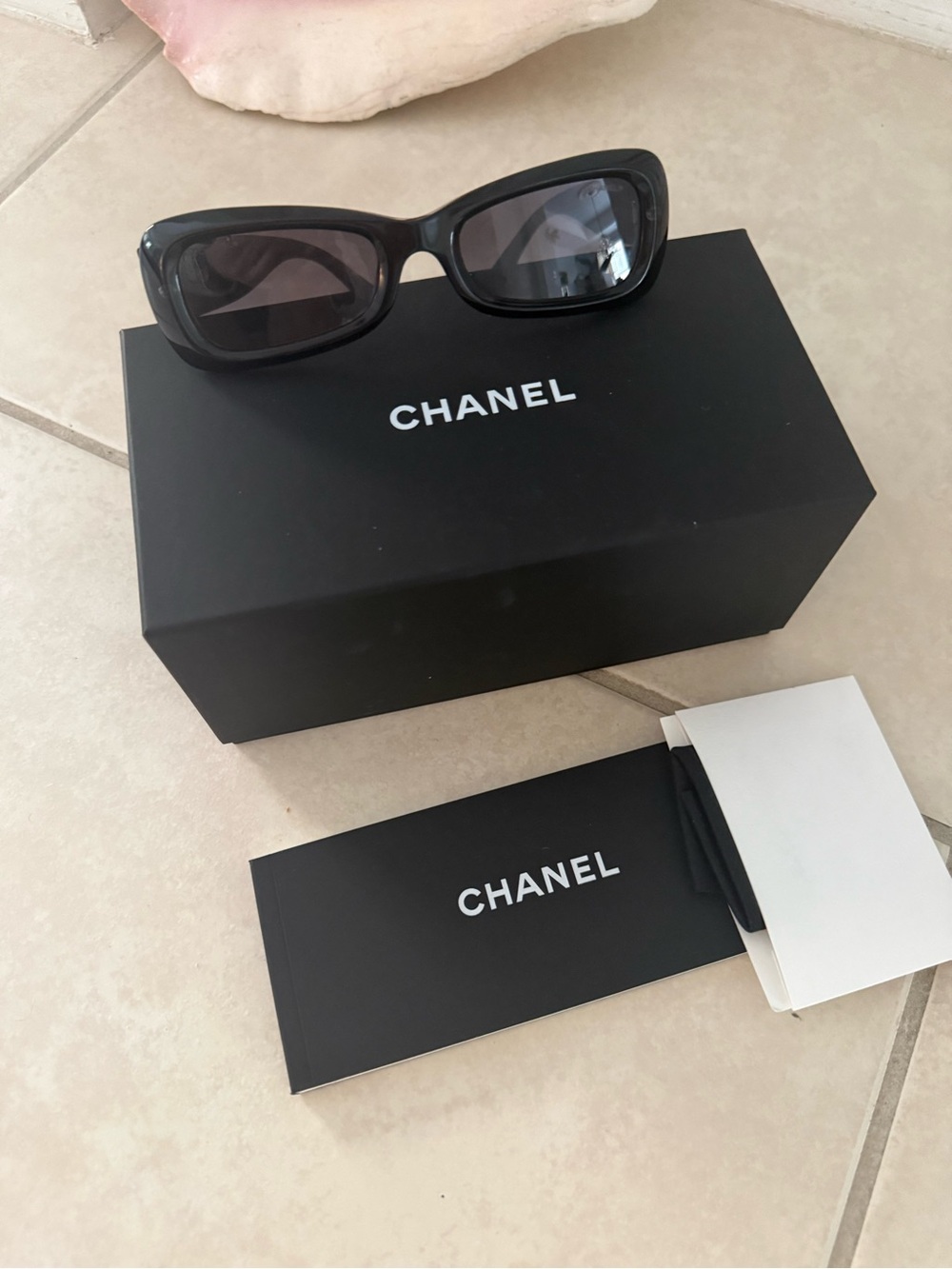 CHANEL 2026 Black Rectangular Logo Sunglasses with Dark Lenses